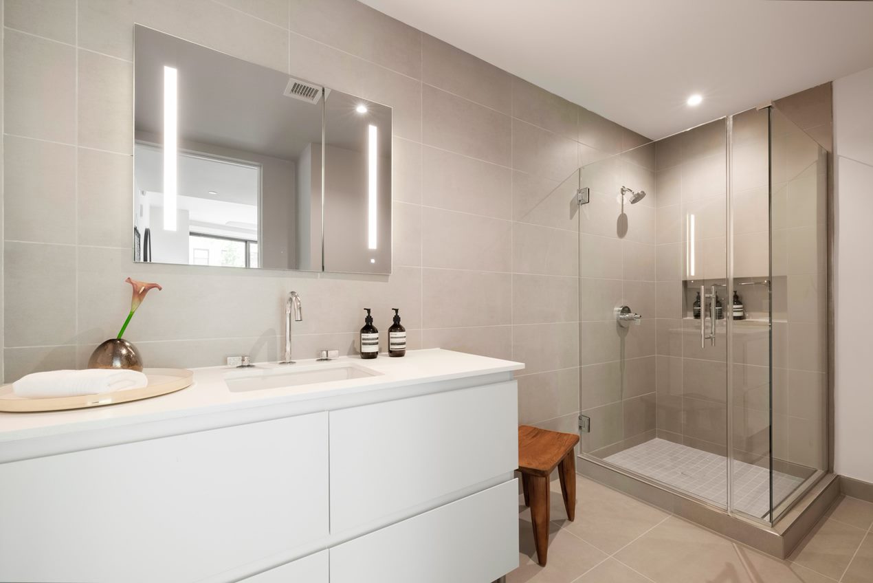 PorcelanosaÂ® tile, RobernÂ® medicine cabinets, and KohlerÂ® fixtures in bathrooms