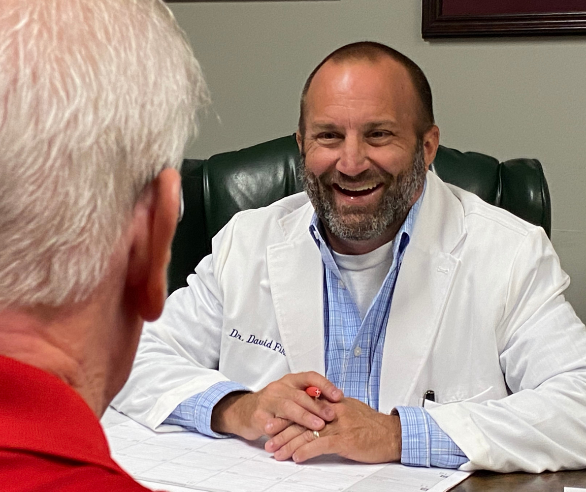 Chiropractor Dr. David Fike meets with a patient at Fike Chiropractic & Acupuncture - Tulsa