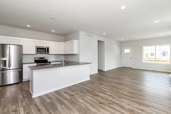 Spacious kitchen with decorative light fixtures
