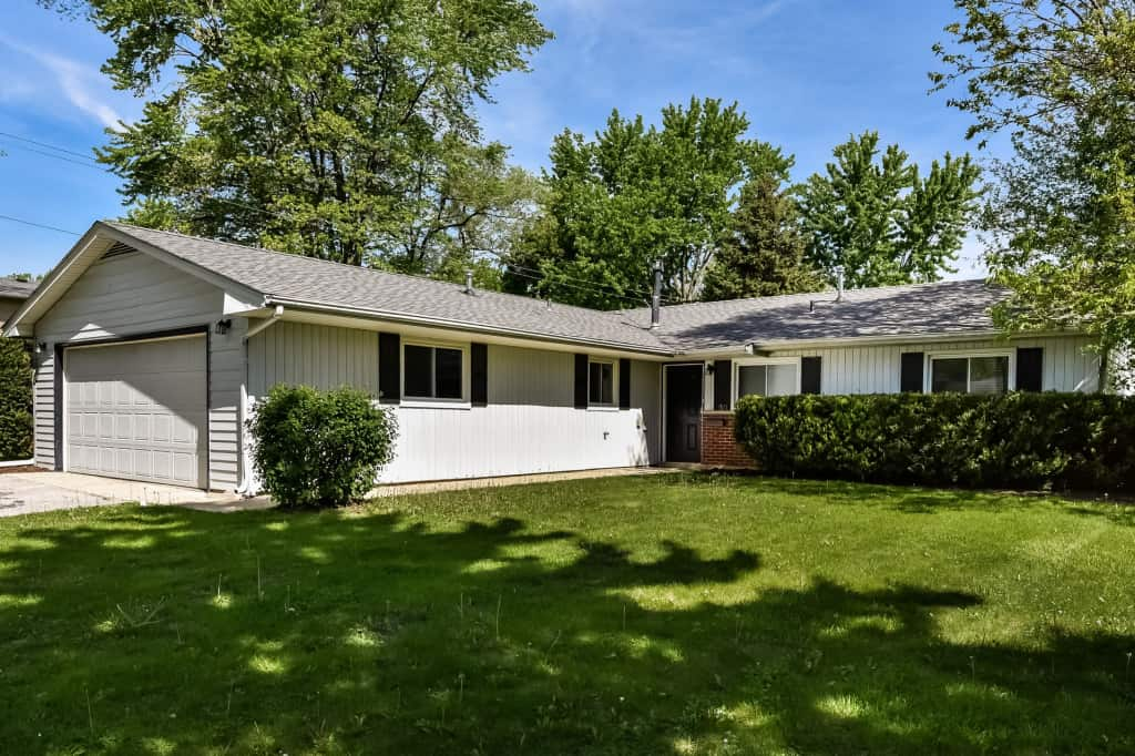 Charming home with garage and large front lawn at Invitation Homes Chicago.