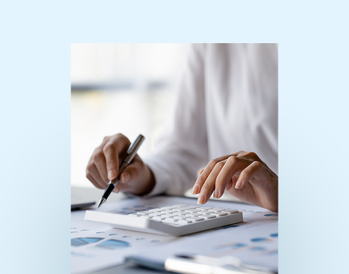 A close-up of an individual using a calculator.