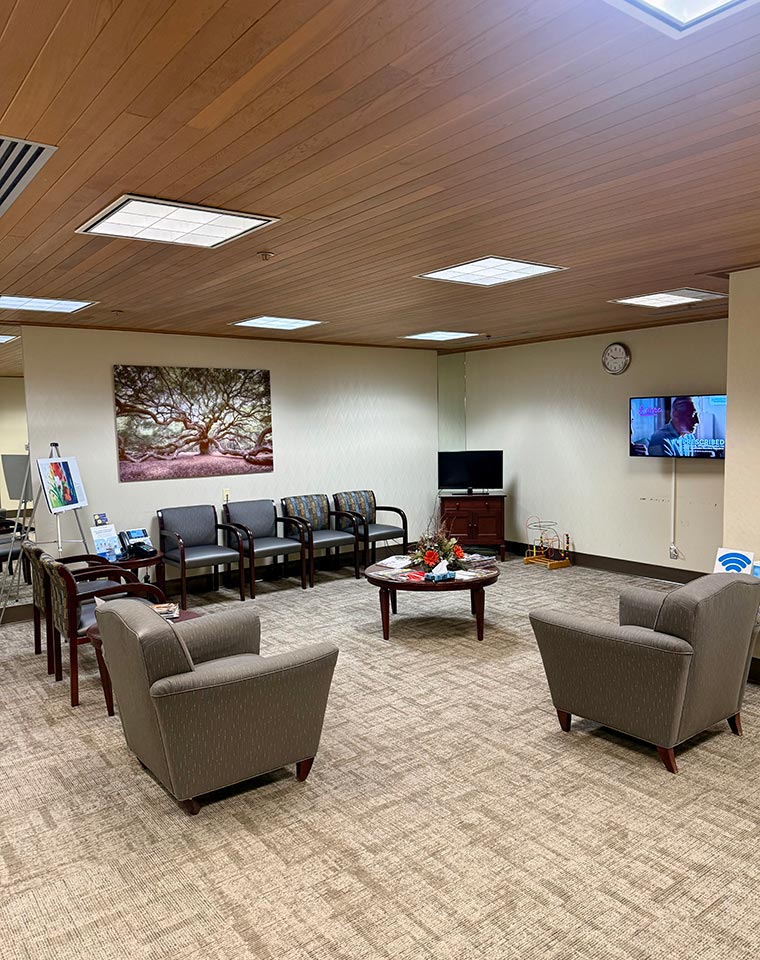 The CCNW clinic lobby offers comfortable seating and vibrant artwork, creating a welcoming space.