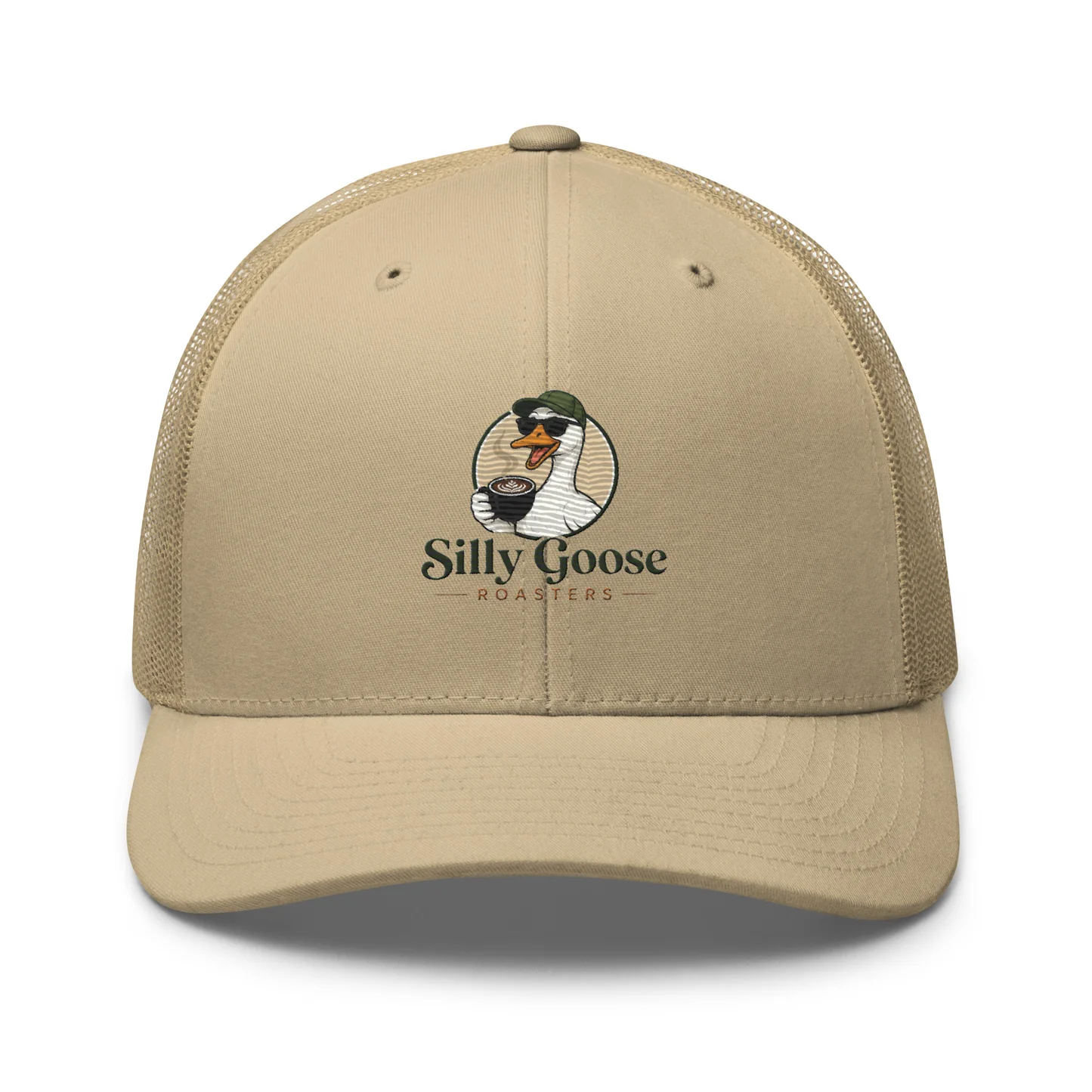 A close-up studio shot of a tan mesh trucker hat featuring a circular logo with a cartoon goose wearing sunglasses and holding a coffee cup.