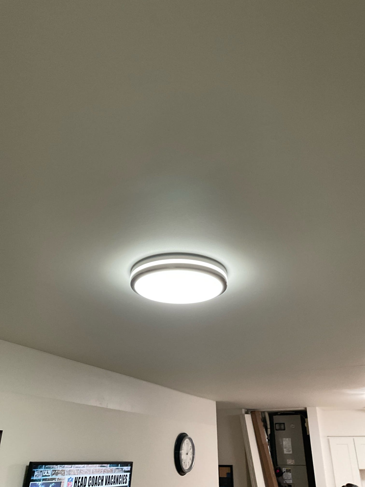 Thomas Edison Electric installed a modern LED flush-mount ceiling light with a double-ring design in a North Wales, PA living space. The bright, energy-efficient fixture provides even overhead illumination across the room.