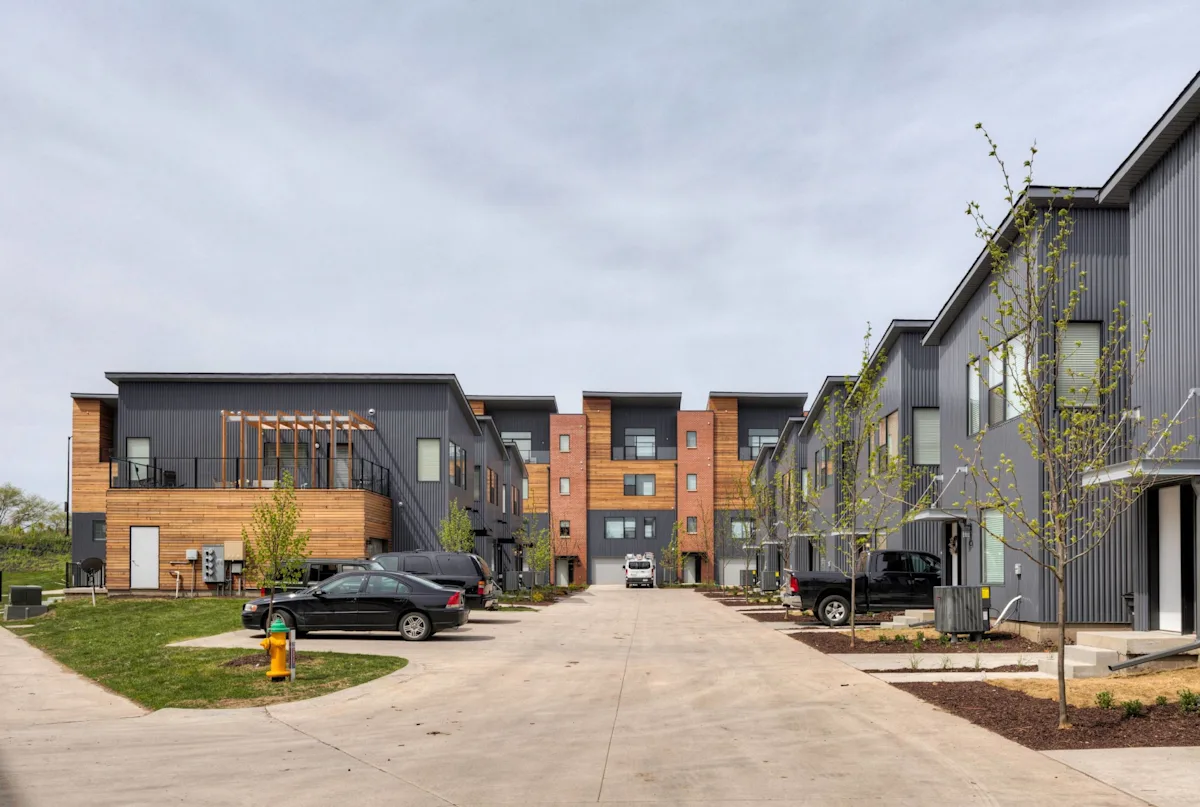 Front view of townhomes building with garages