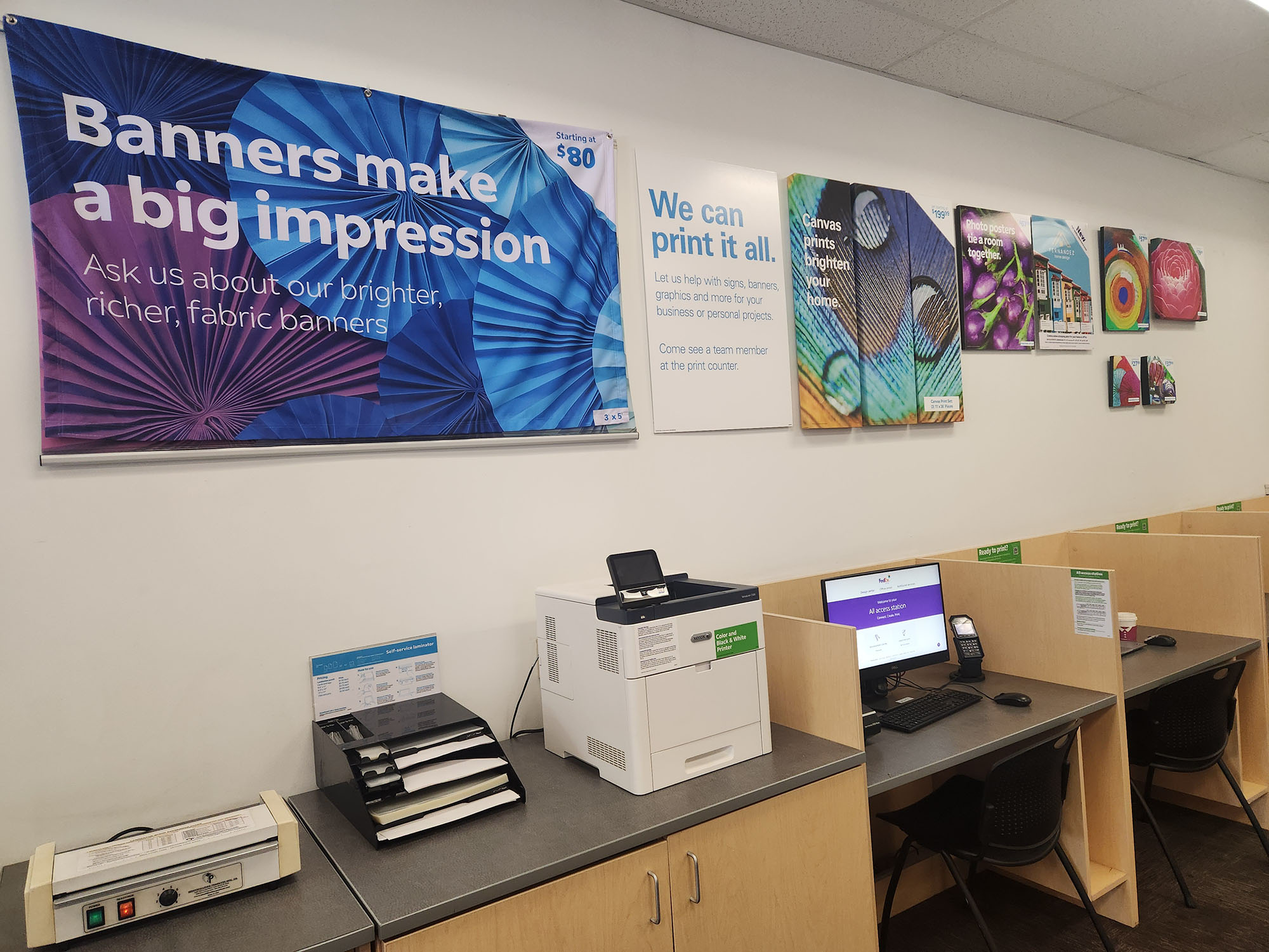 Marketing and Print Sample Wall &ndash; Sample wall showcasing posters, banners, and marketing materials available at FedEx Office Riverside.
