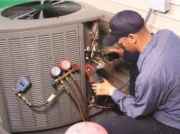 Technician working on HVAC repair