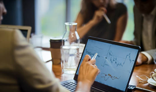 An advisor reviewing the markets on their laptop.