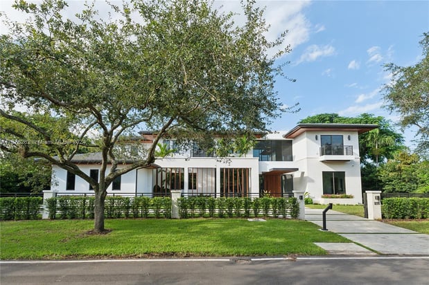 Images Joel Freis and Denise Madan - All Florida Home Team - REAL Broker