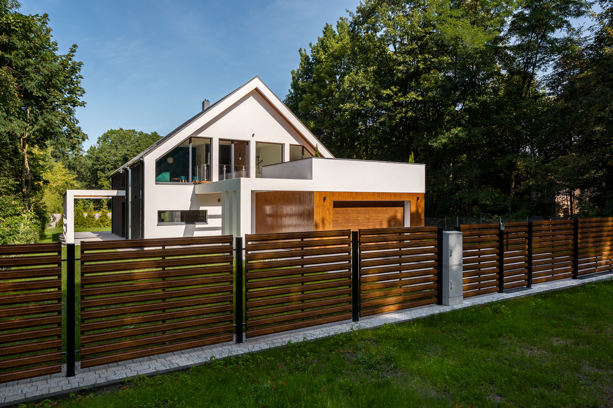 horizontal wooden slat fencing with black metal posts