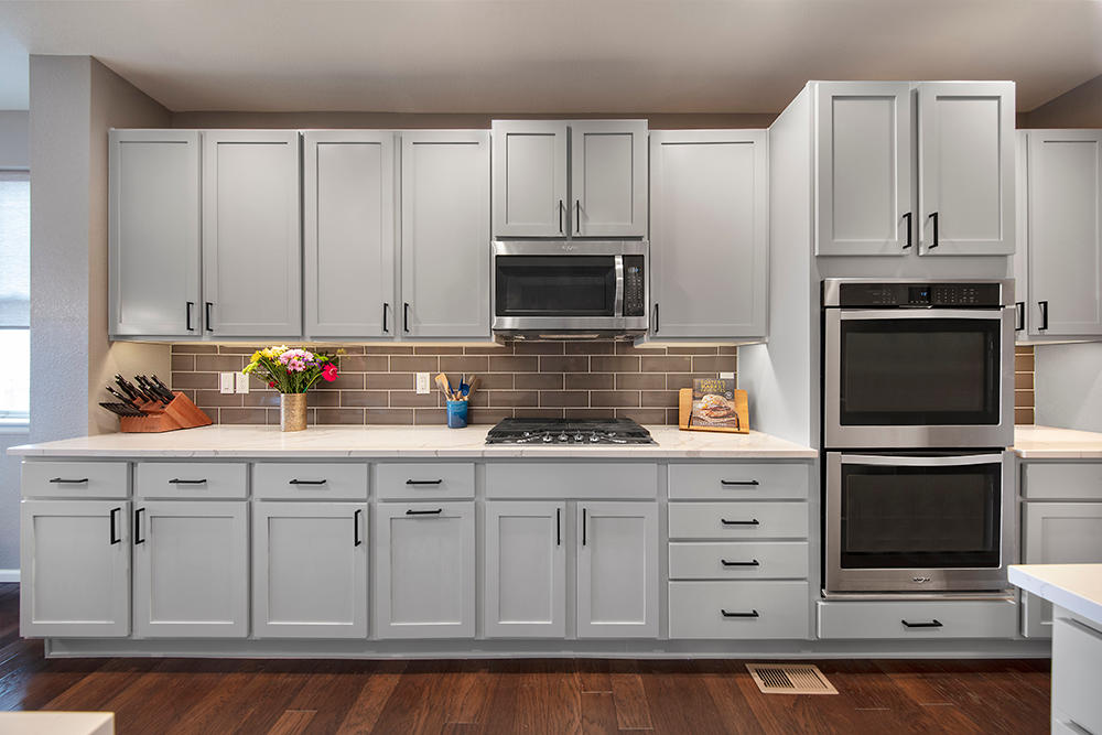 Soothing gray kitchen cabinets after cabinet painting