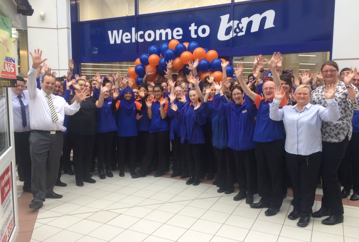 B&M Bury's store team pose outside their brand new store at Mill Gate Shopping Centre, following relocation from Angouleme Retail Park.
