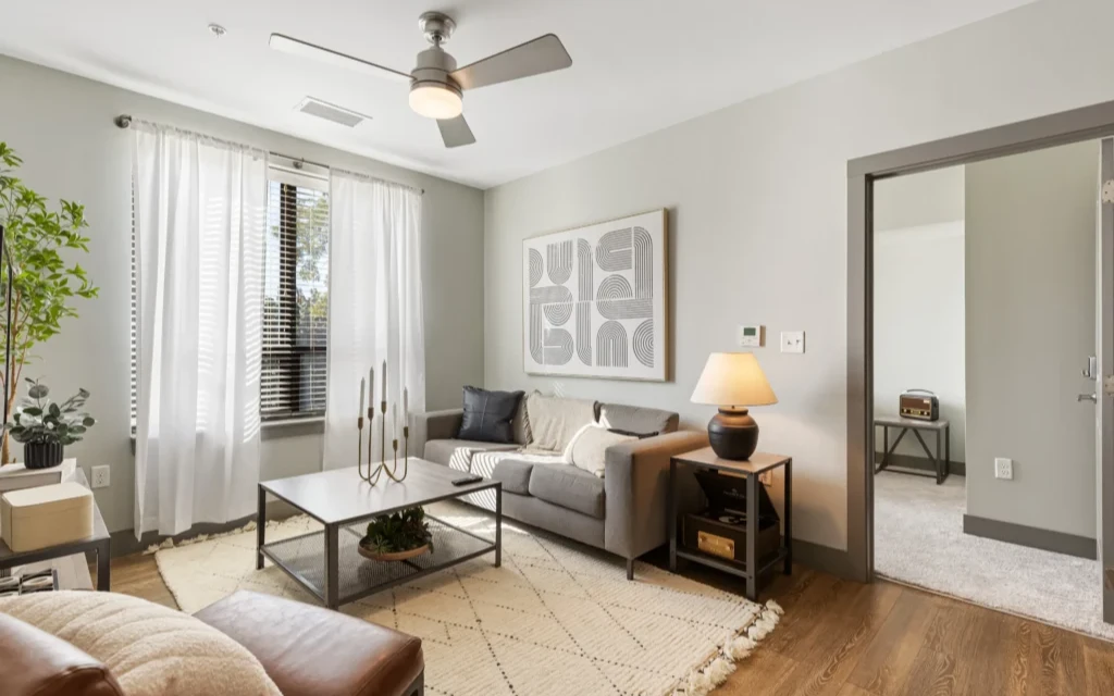 Fully furnished spacious living room with hardwood flooring