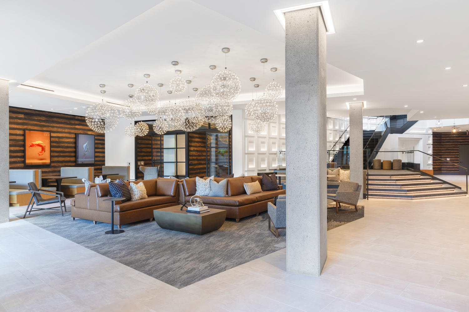 Dramatic, double-height lobby lounge with abundant soft seating.