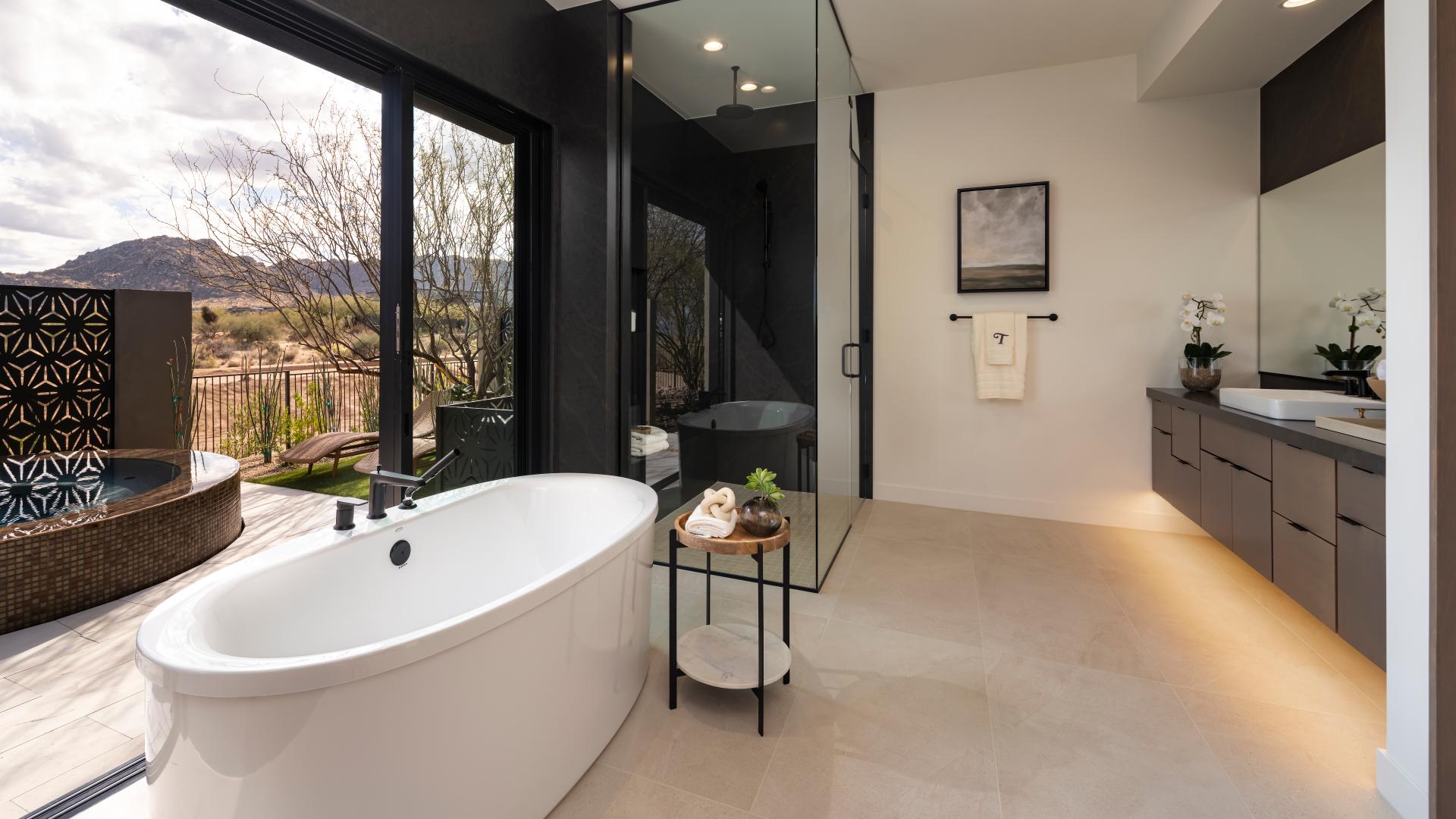 Spa-like primary bathrooms with dual vanities, large soaking tubs, and luxe walk-in showers