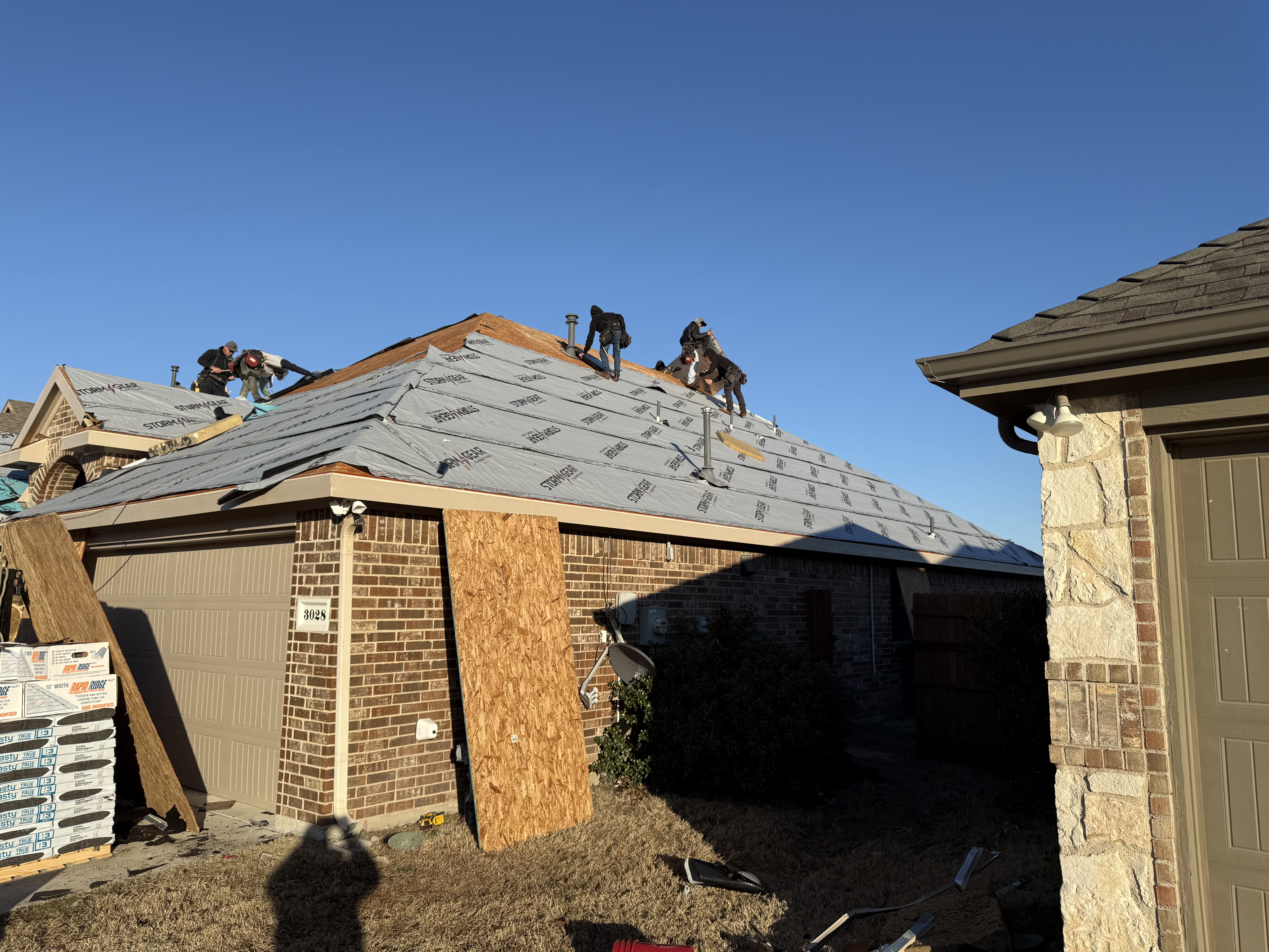 Down to bare decking and installing synthetic felt to keep your roof dry.