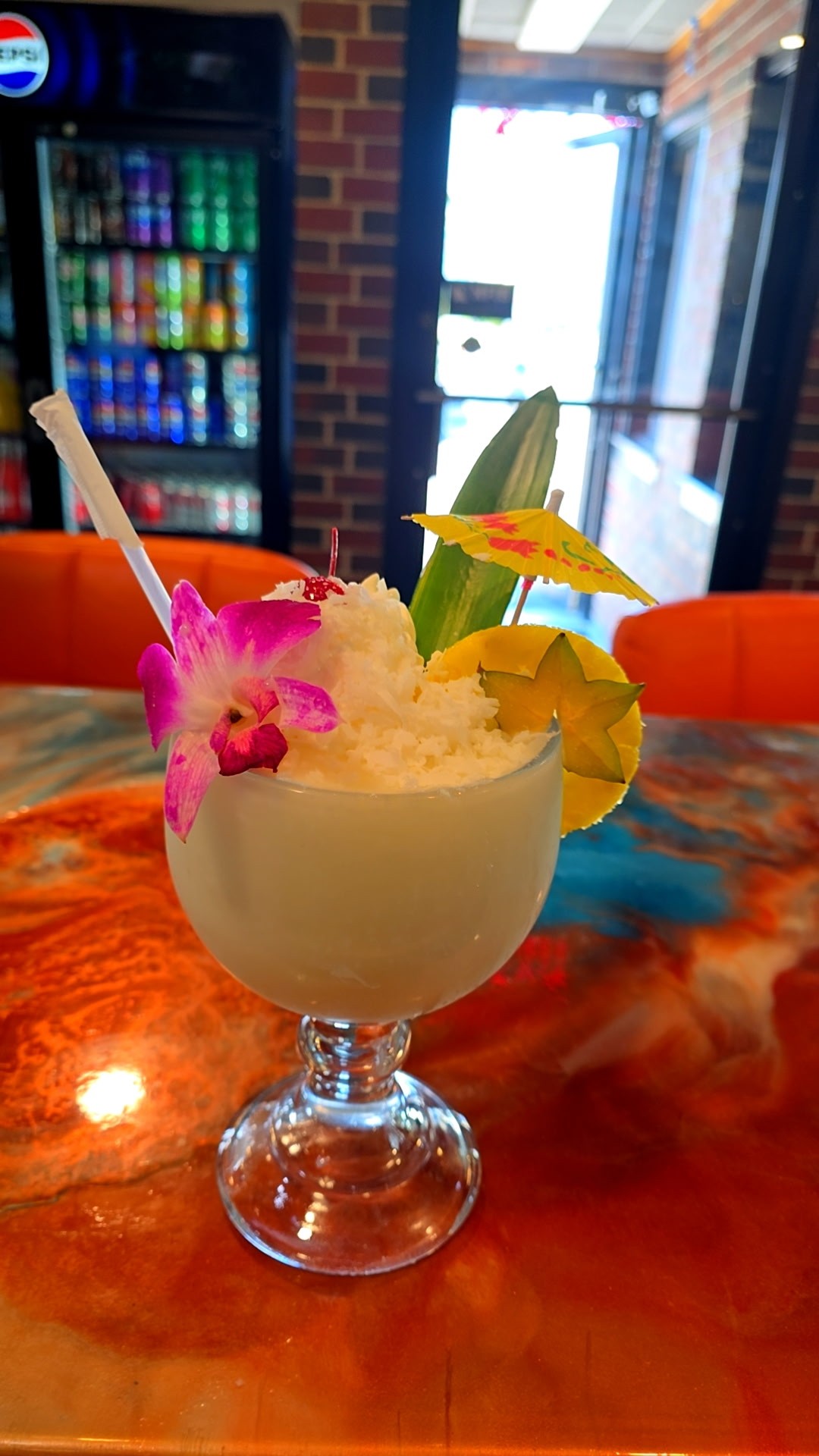 Frozen tropical cocktail served at Catramex Restaurant featuring a creamy blended drink with refreshing island-inspired flavors and vibrant presentation in Southern Maine.