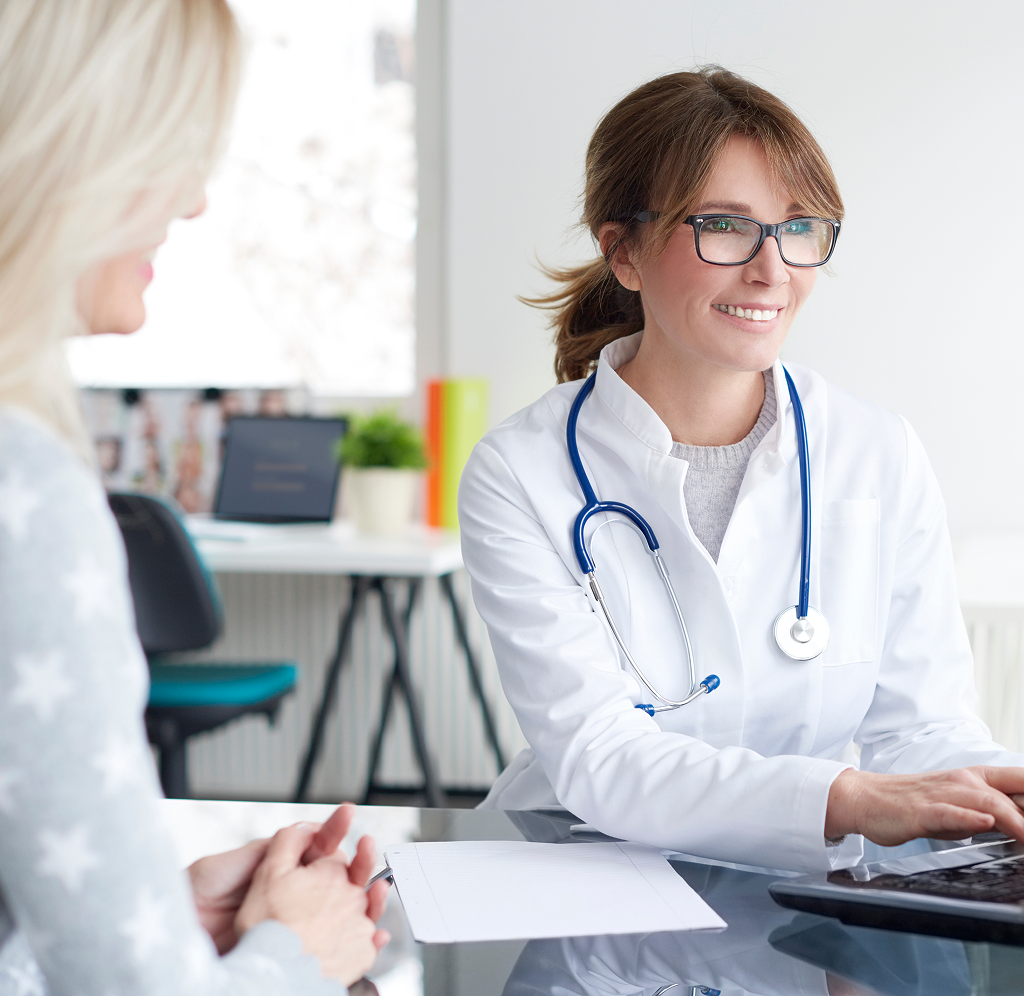 A doctor meeting with her patient.