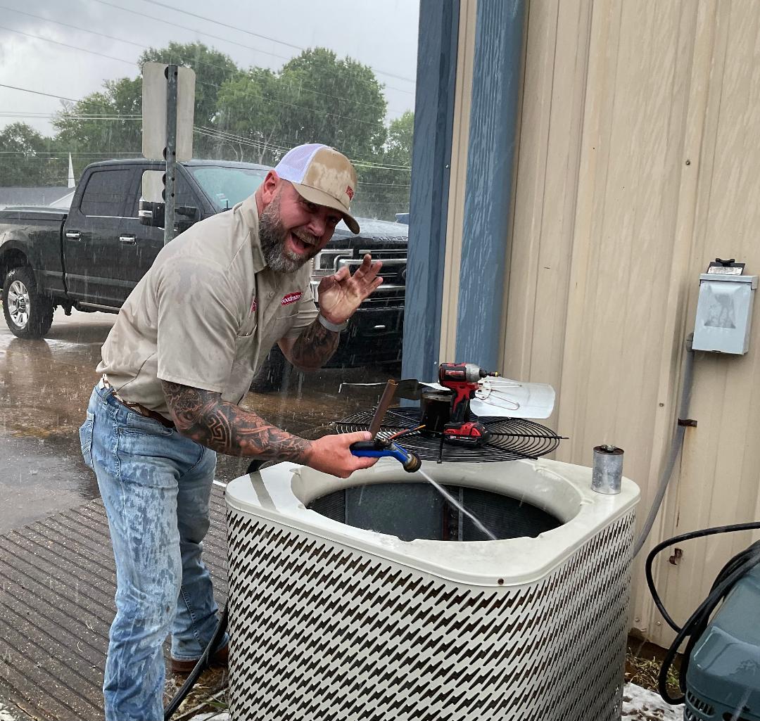 Owner Patrick Bentley working alongside our techs in the rain on a field day
