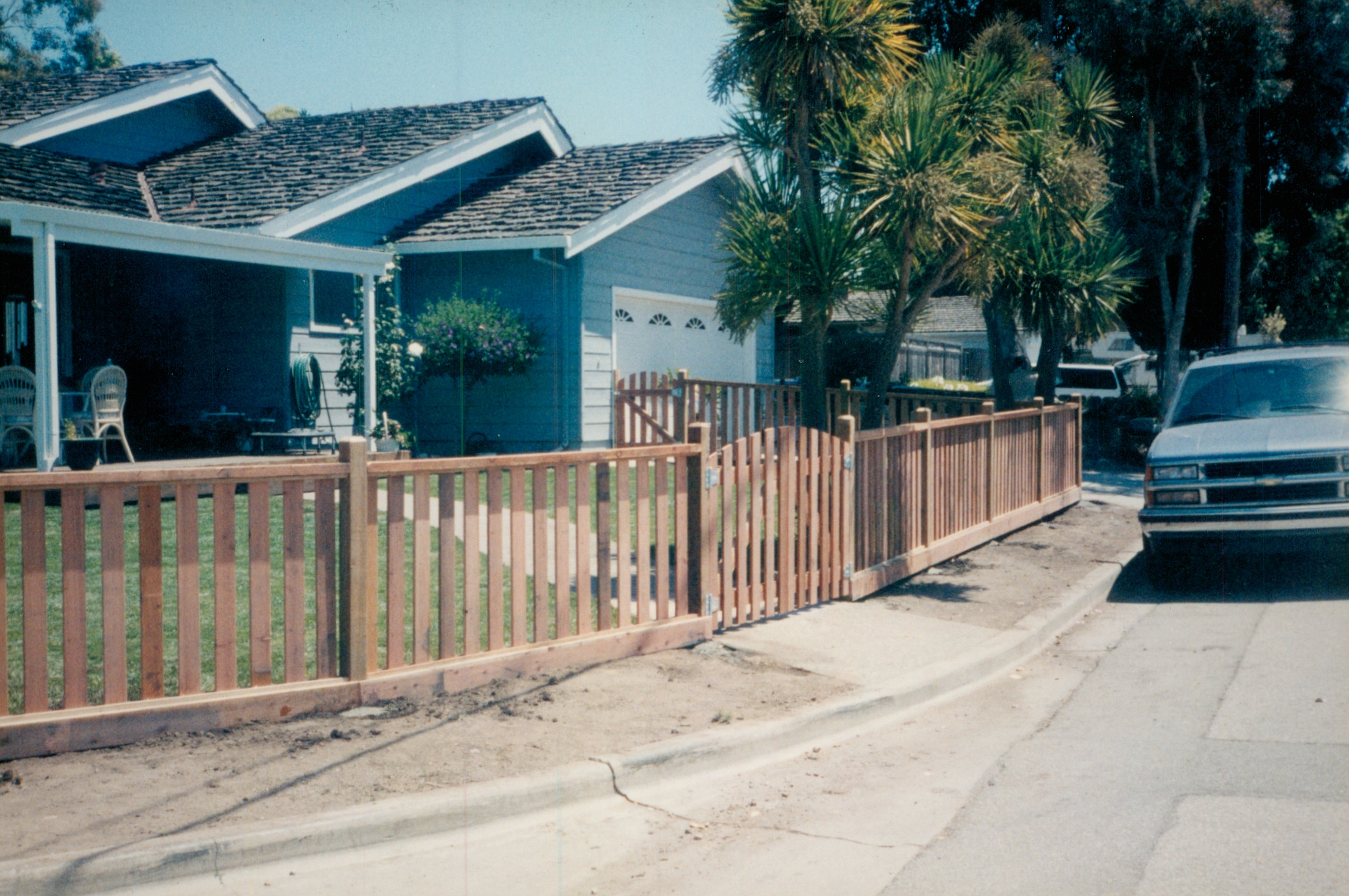 Residential wood fence installed along a front property line to define the space and improve curb appeal.