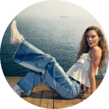 woman wearing jeans and tank top