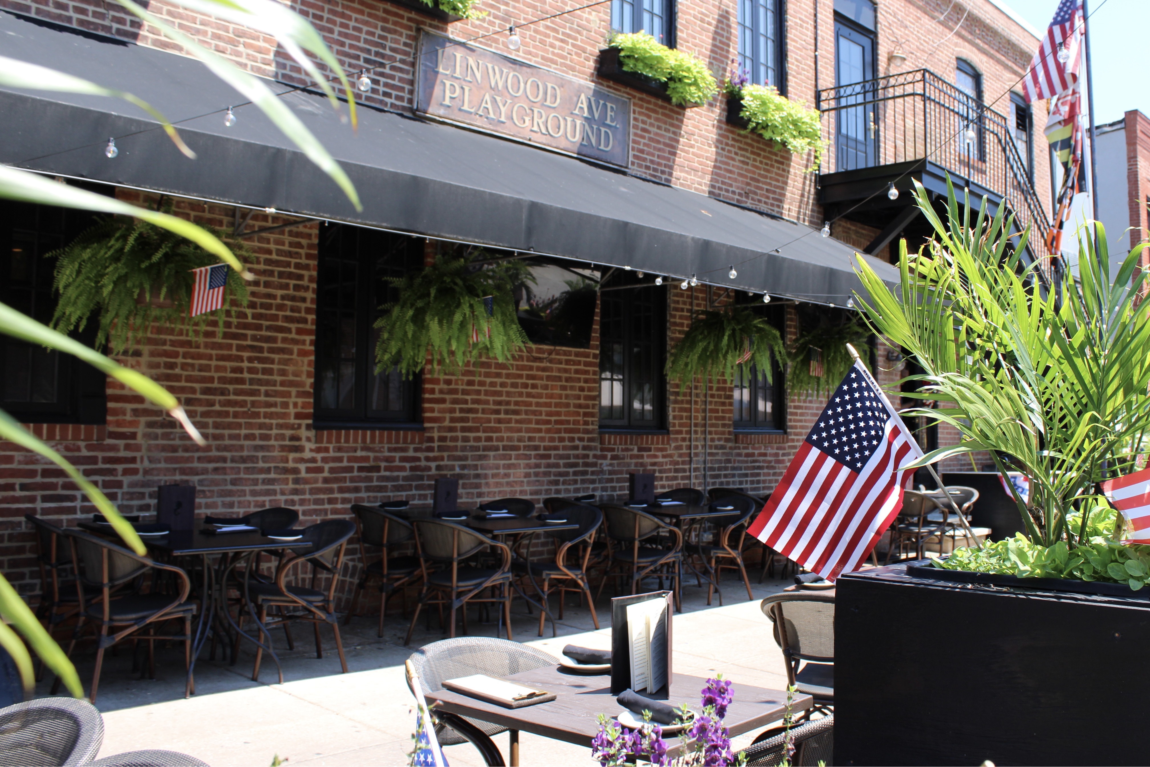 Mama's On The Half Shell Baltimore Outdoor Dining Area dressed in American flags for Fourth of July 