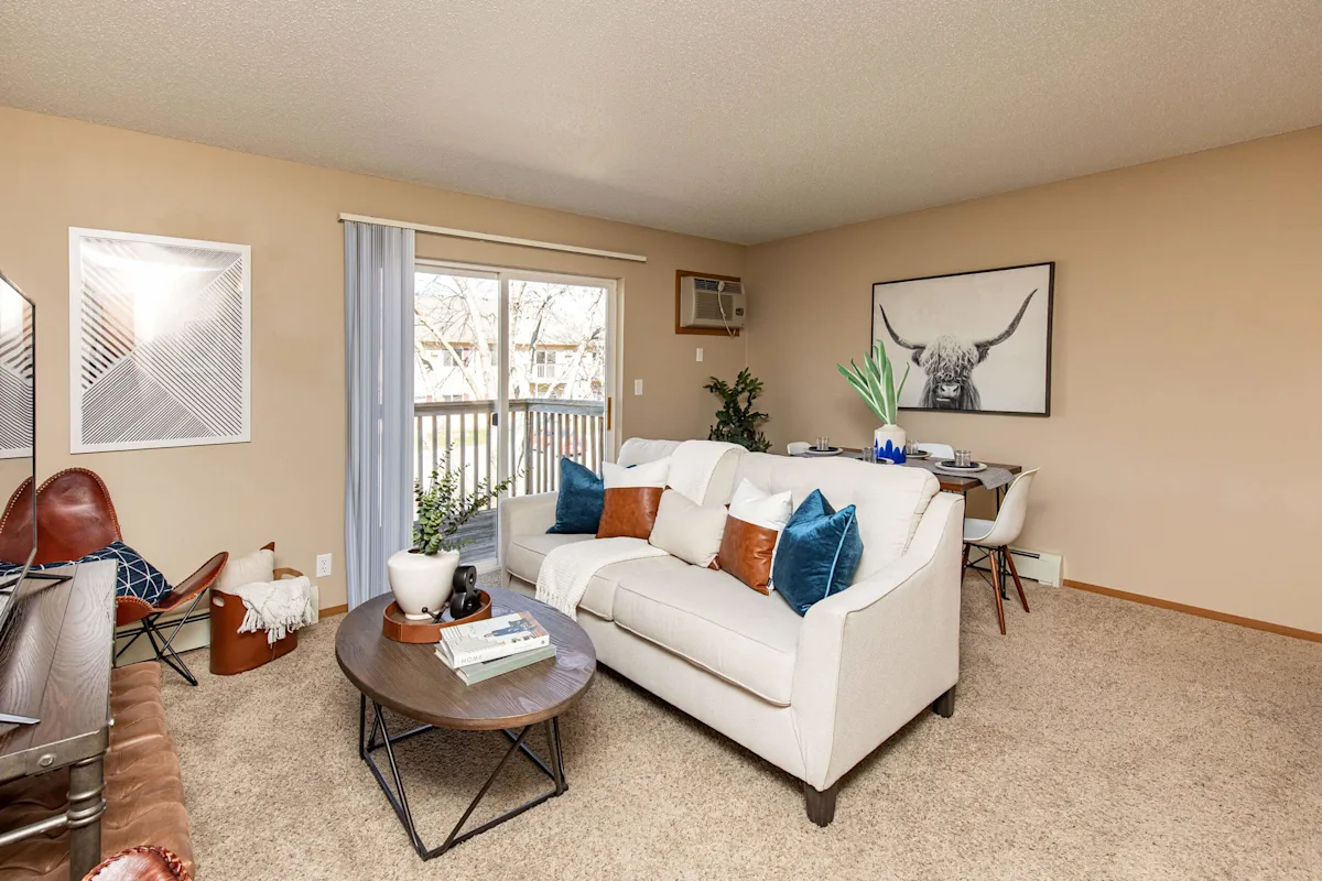 Spacious living room with sofa and dinning space