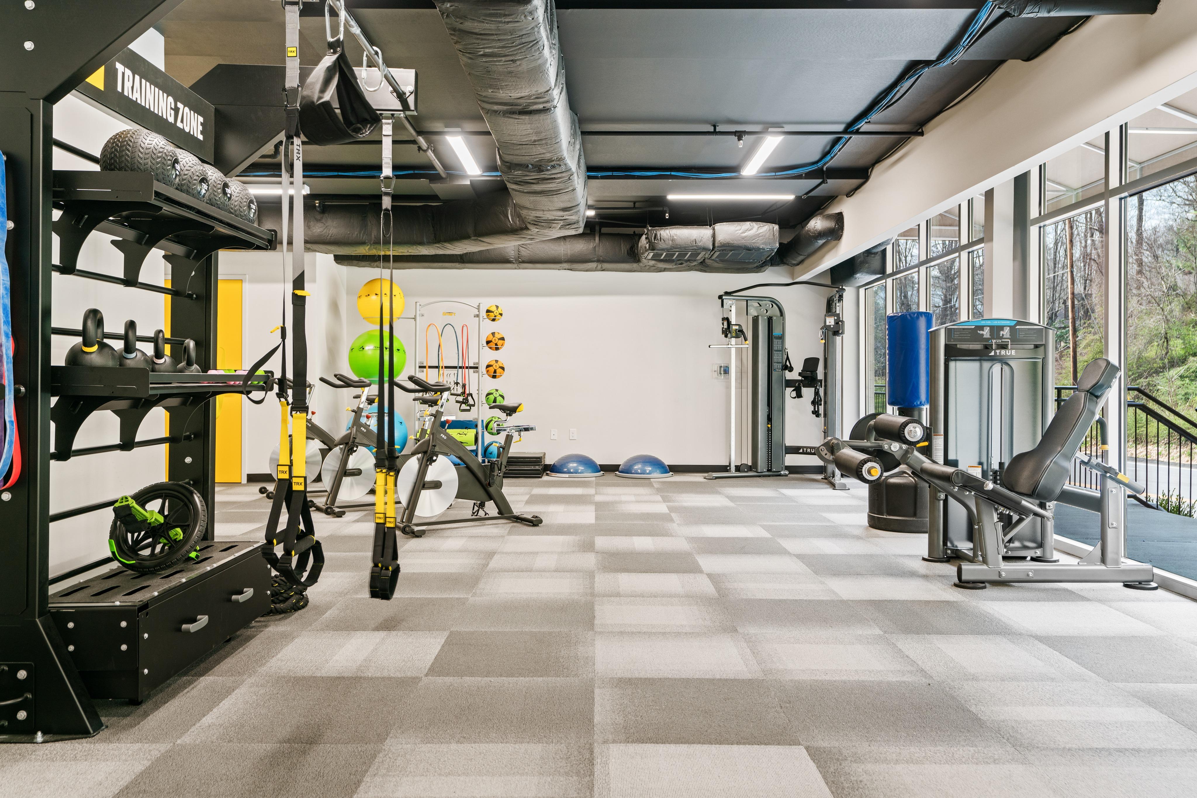 Large fitness center with free weights and medicine balls