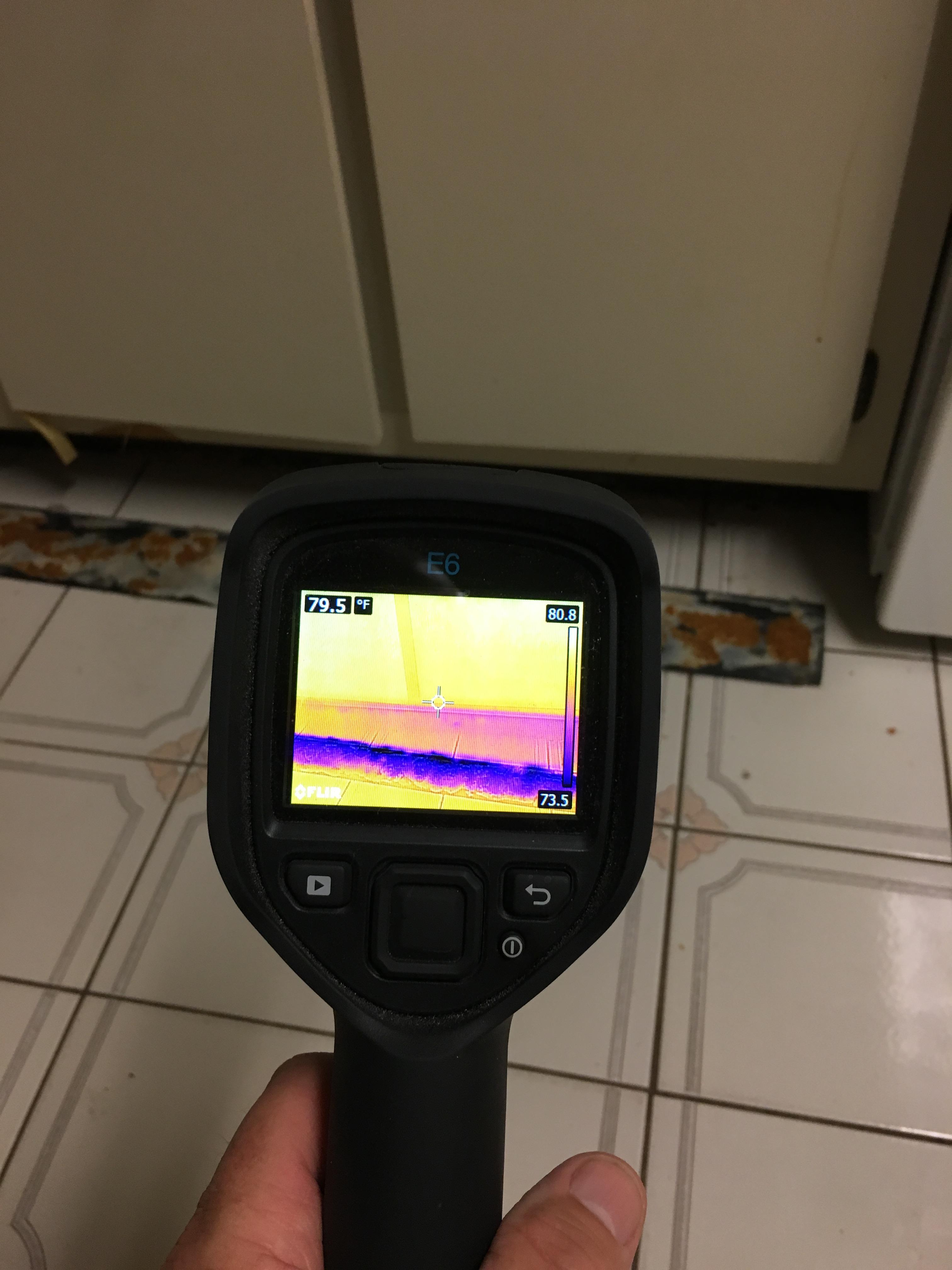 Breaking out the thermal camera to check for moisture after a water loss.