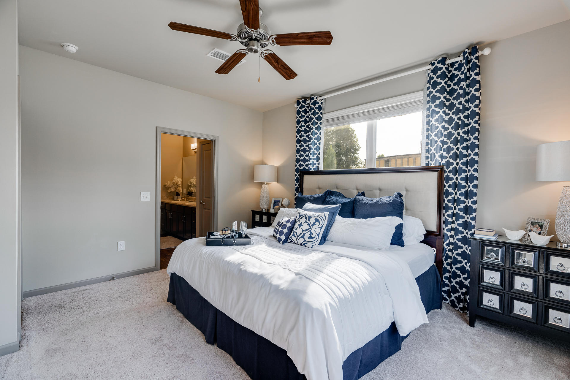 Carpeted Bedroom With Attached Bathroom