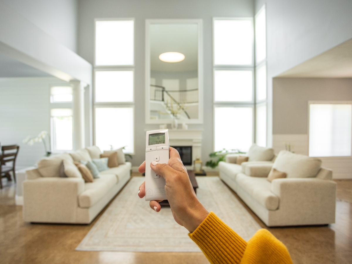 Motorized cellular shades in neutral living room.