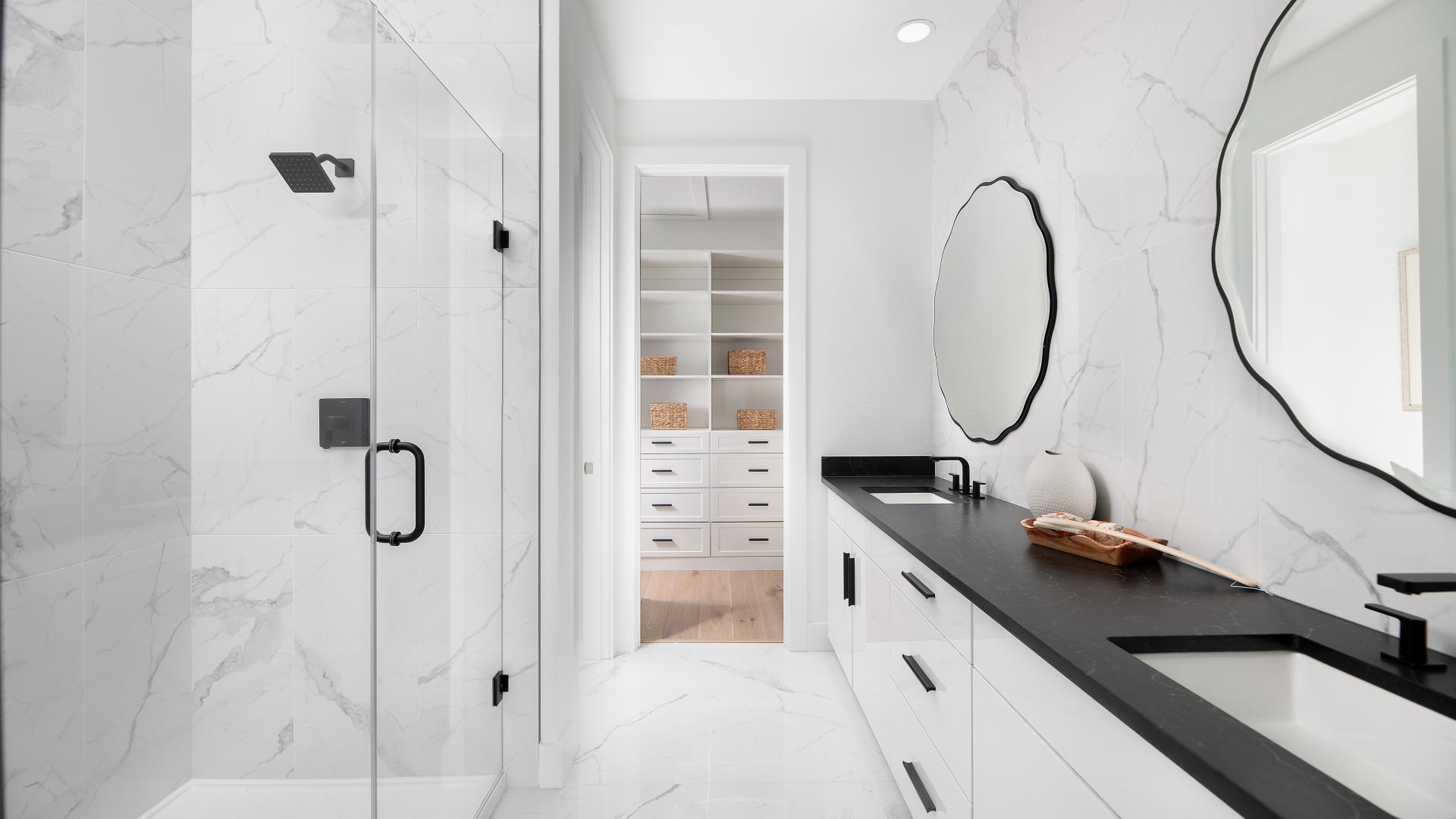 Spa-like primary bathrooms, with large walk-in closet spaces, and dual sink vanity 