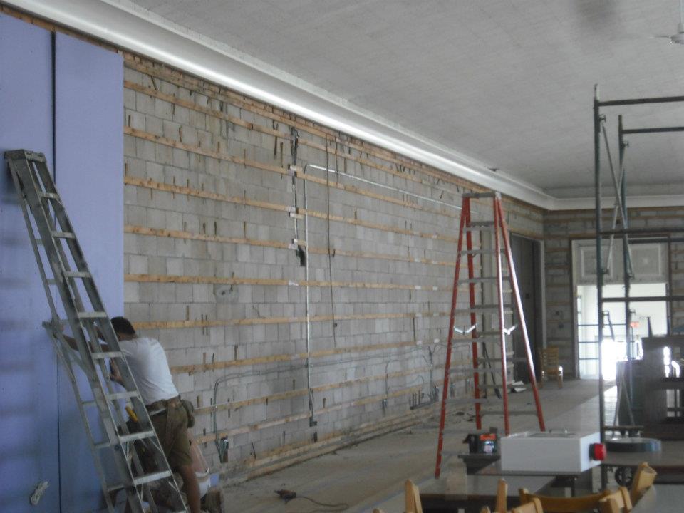 installing sheetrock on a commercial dining room walls