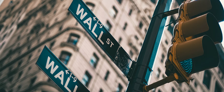 Close-up shot of the Wall Street sign in New York City.