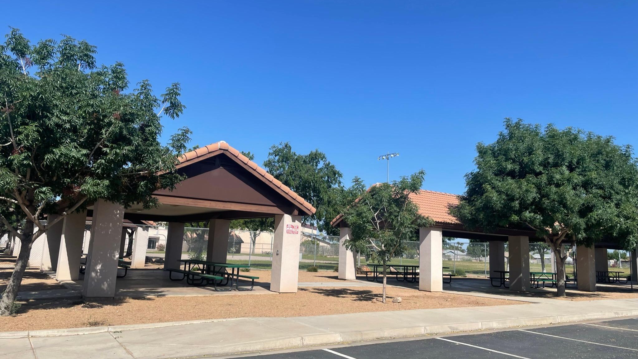 Ramadas and entrance to ball fields just west of the building.