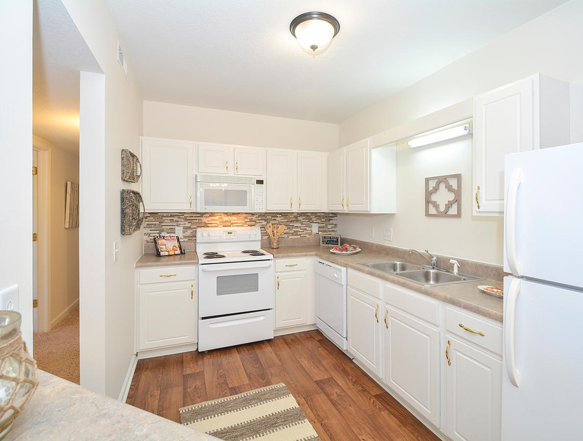 Fully-Equipped Kitchens With White Appliances