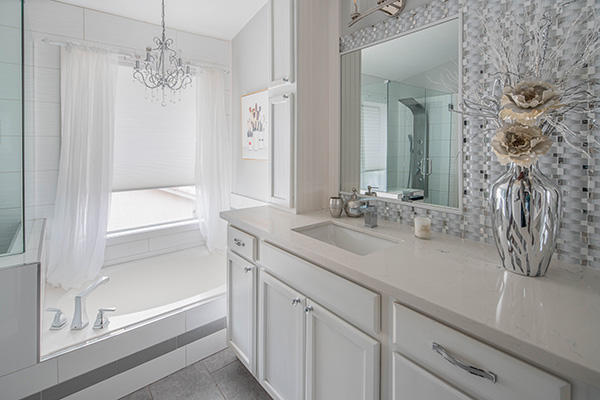 This bathroom just screams Spa Day with these white shades and drapery