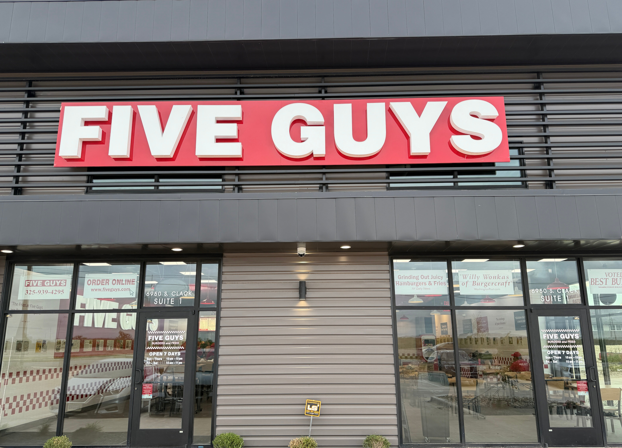 The exterior of the Five Guys restaurant on South Clack Street in Abilene, Texas, with the red and w 