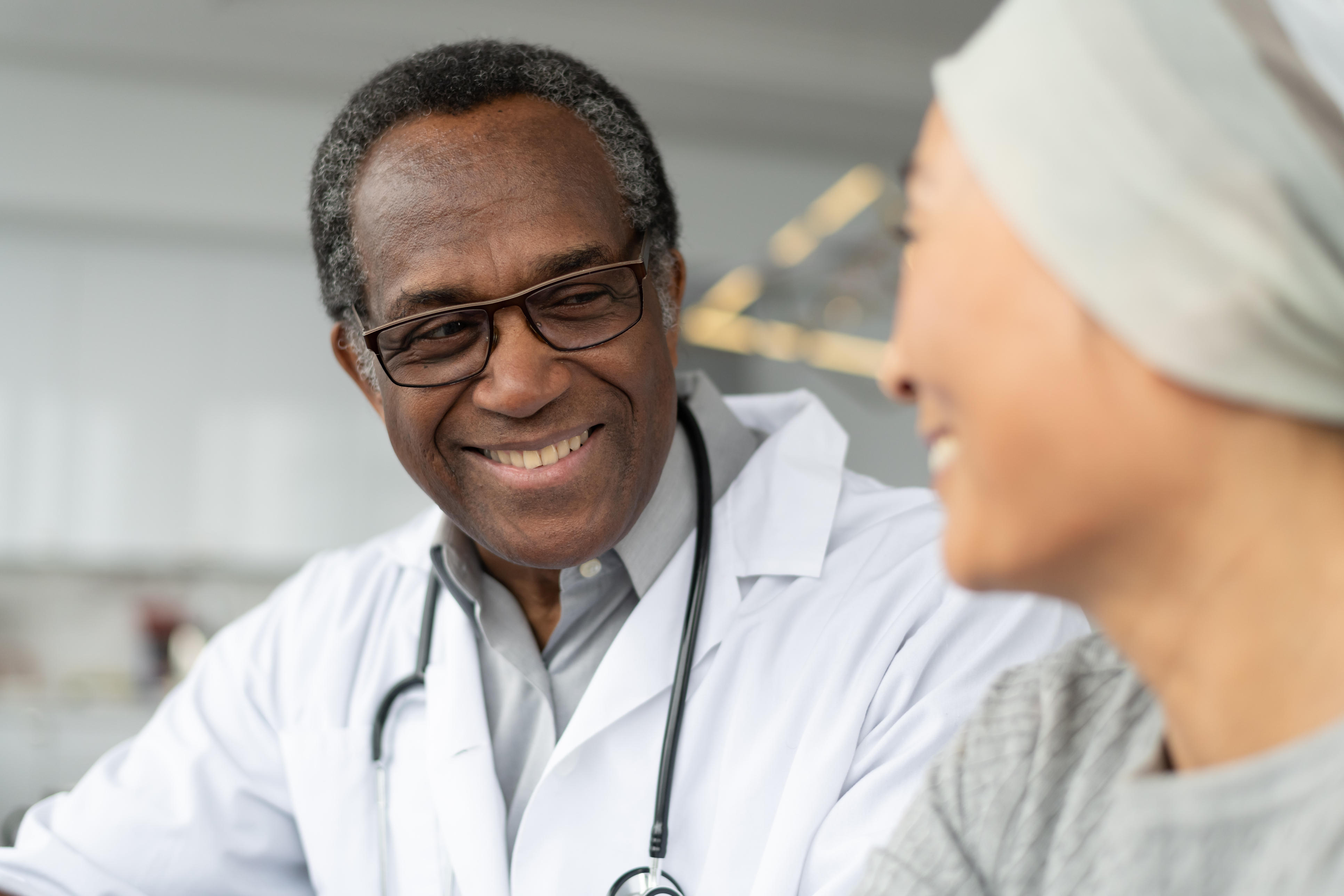 Male doctor smiles at patient