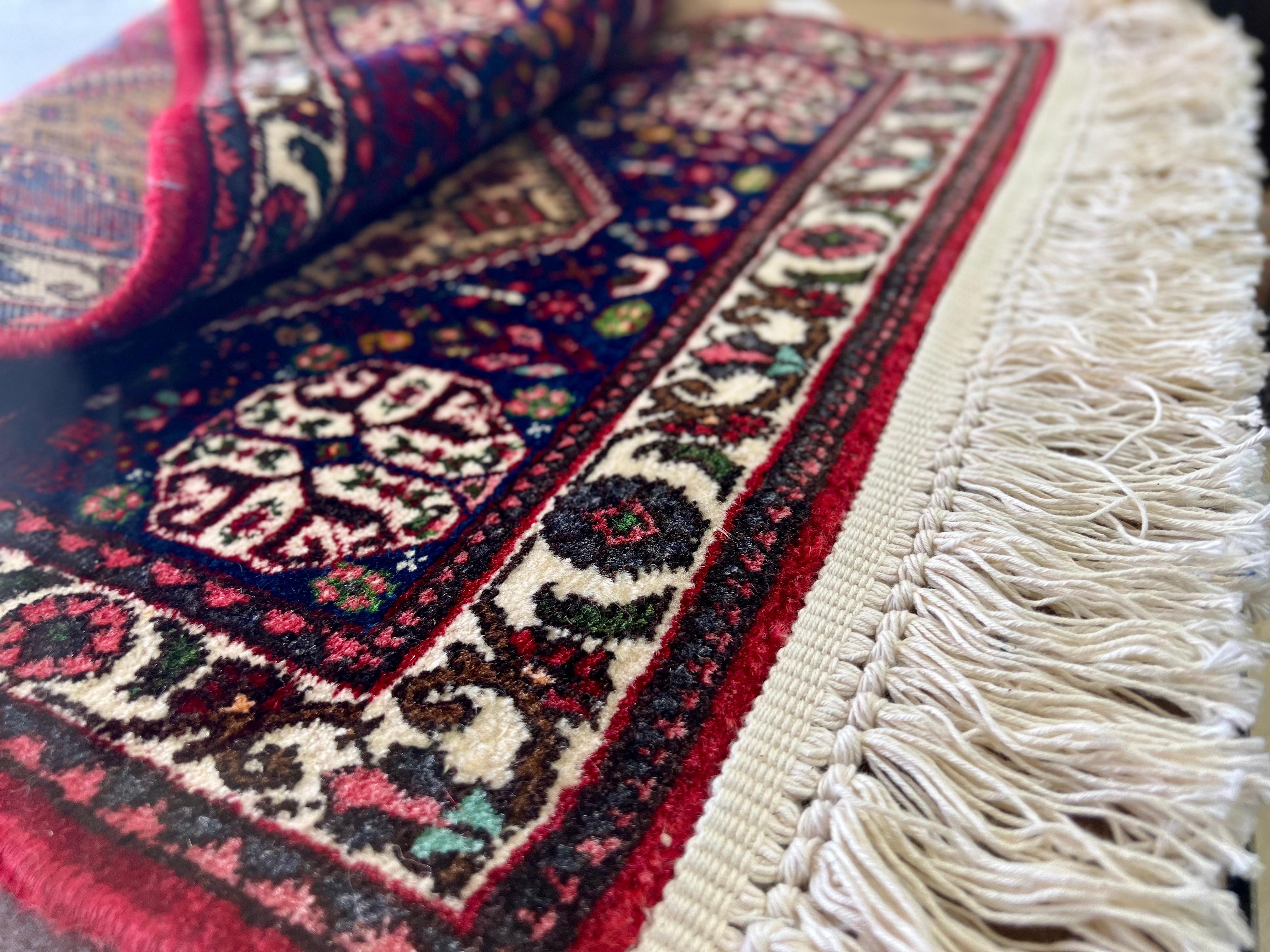 Installation of new cotton fringe on an oriental rug.