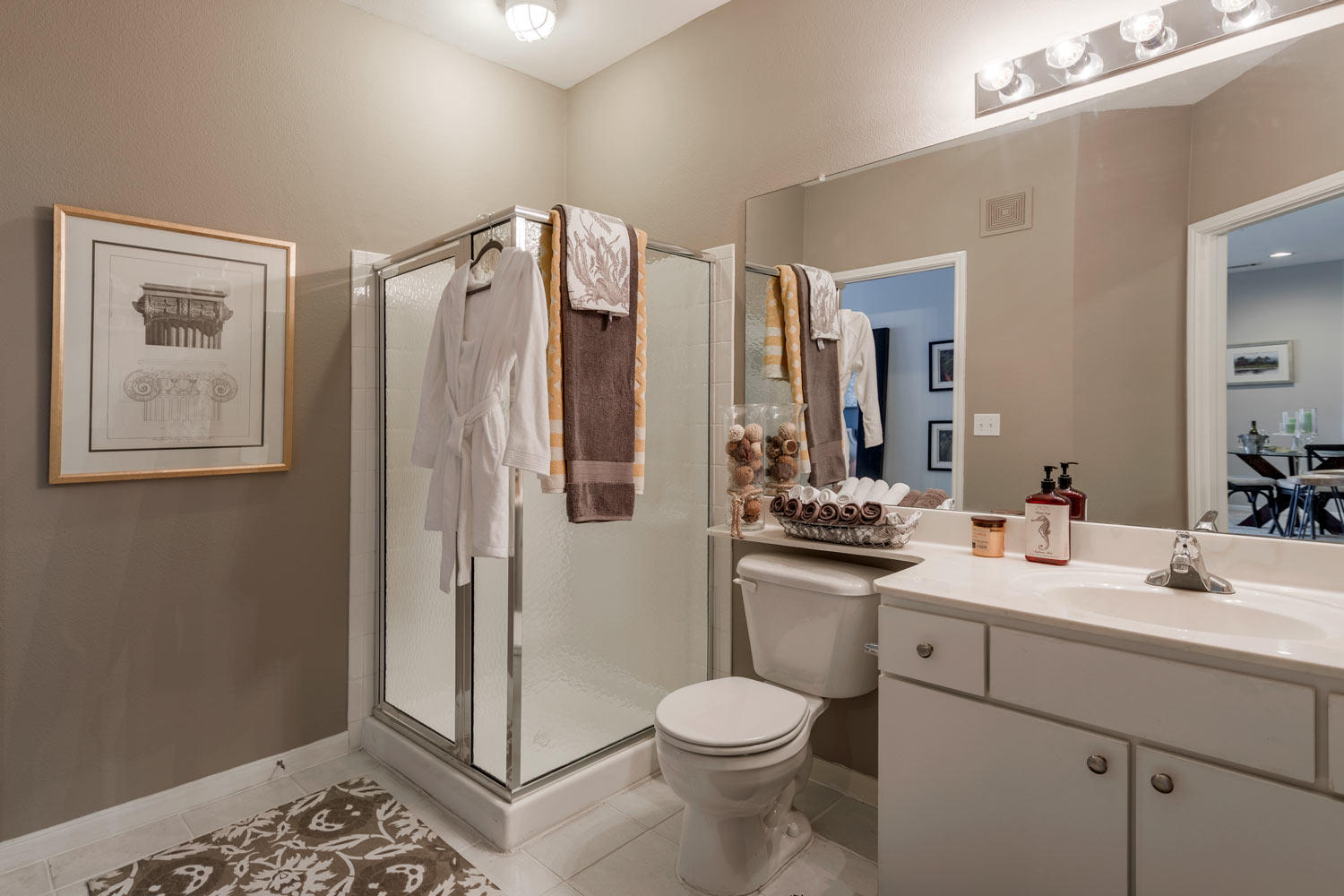 Bathroom with stand in shower and ample storage