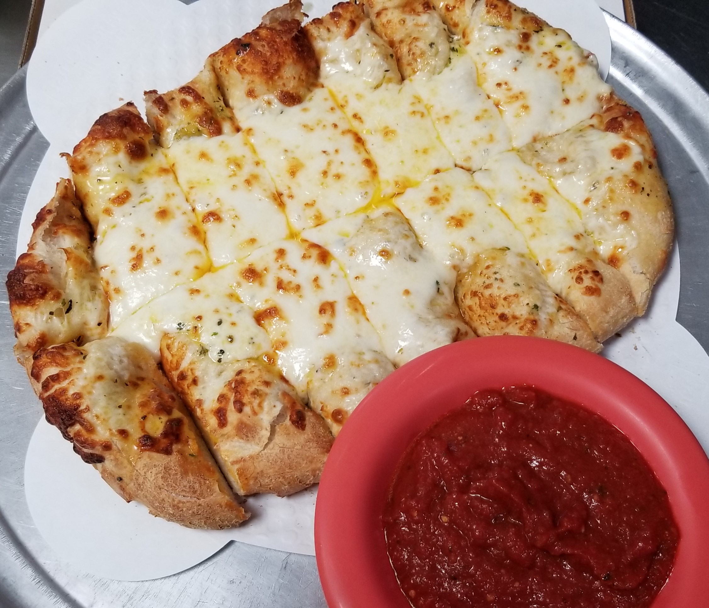 Cheesy Bread Sticks! Served with 2 sides of pizza sauce!