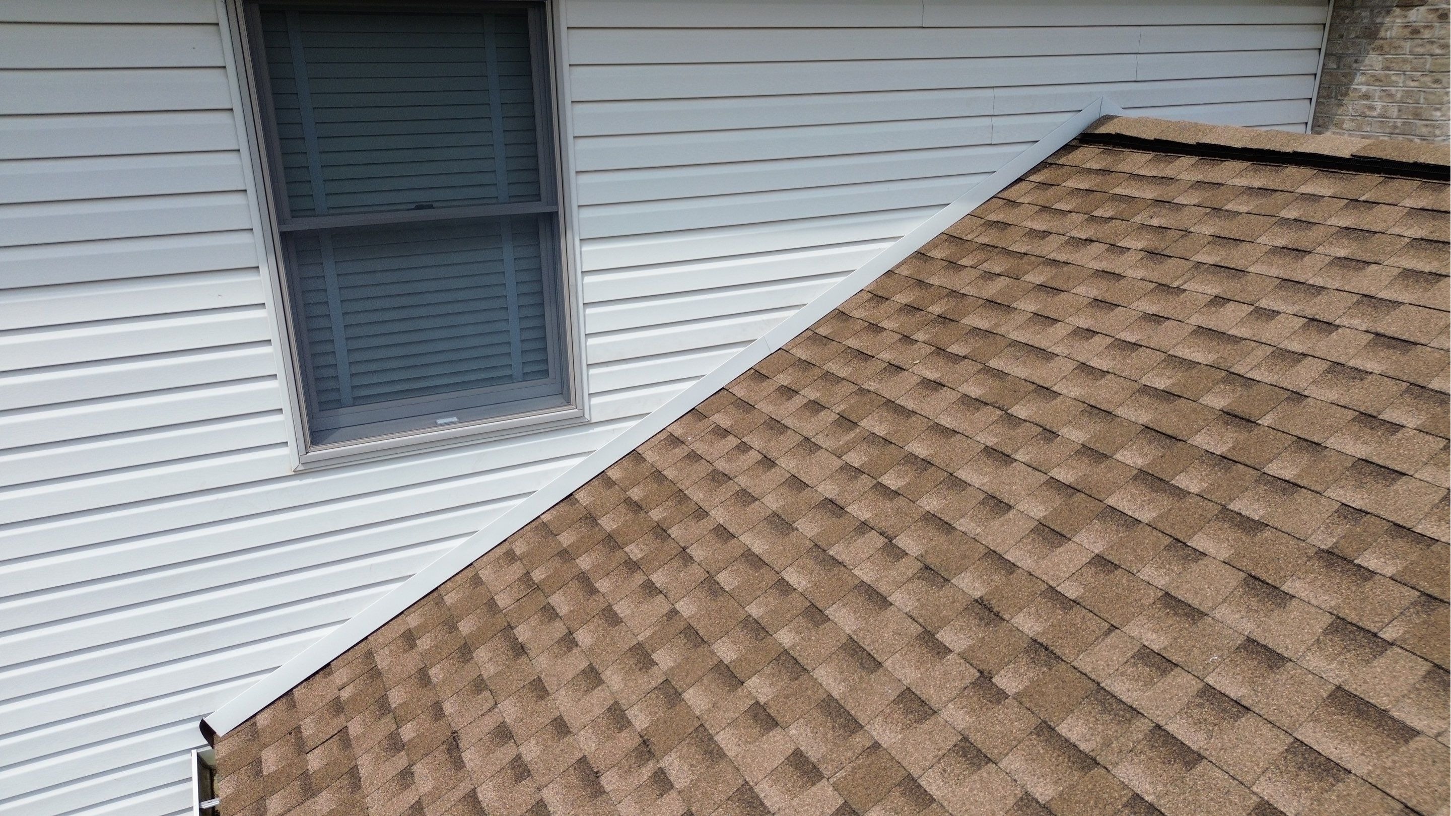 Close-up of completed sidewall flashing on an architectural shingle roof in Westminster, Maryland, s 