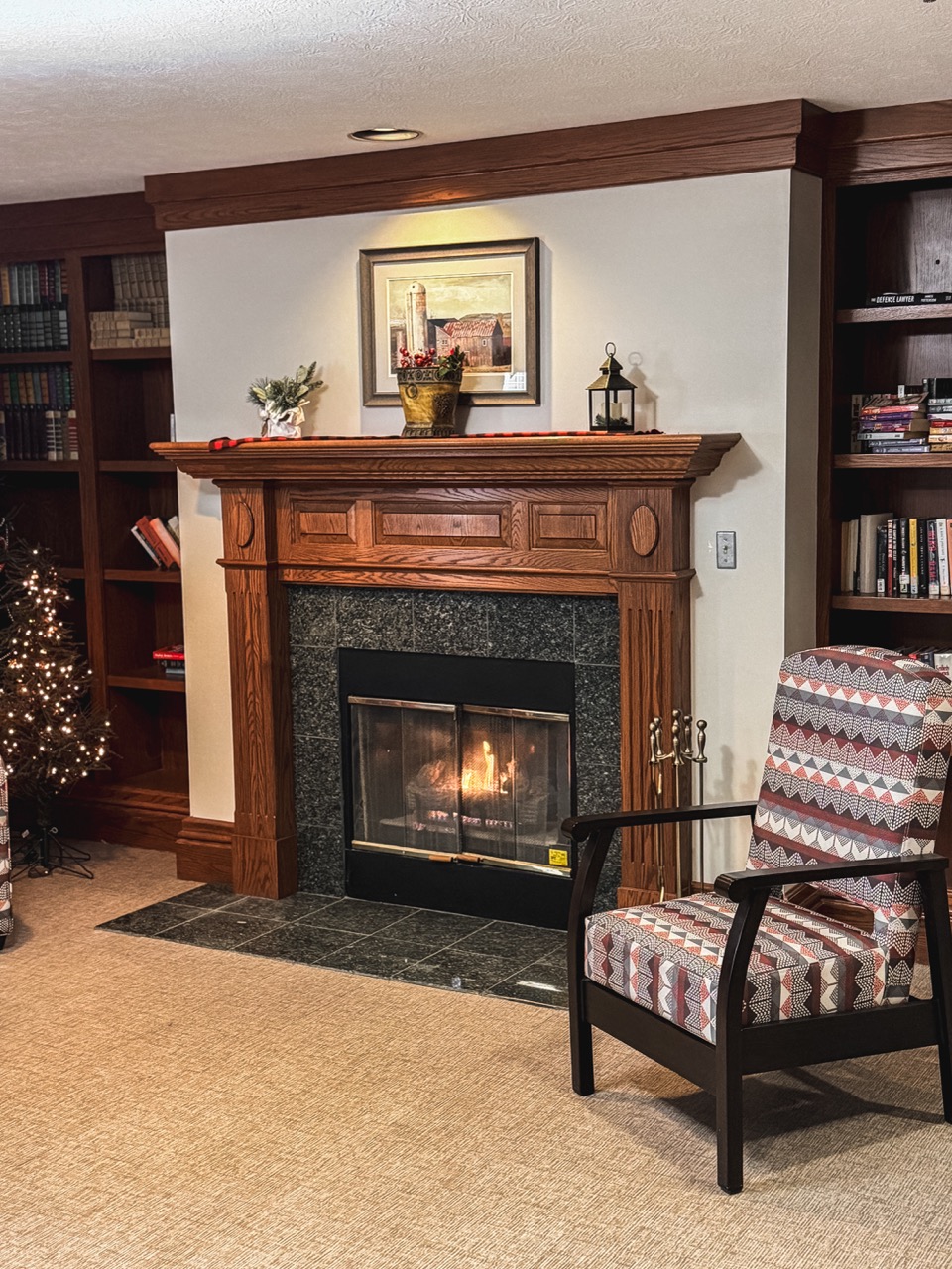 The Oaks at Shady Lawn community space with a cozy fireplace.