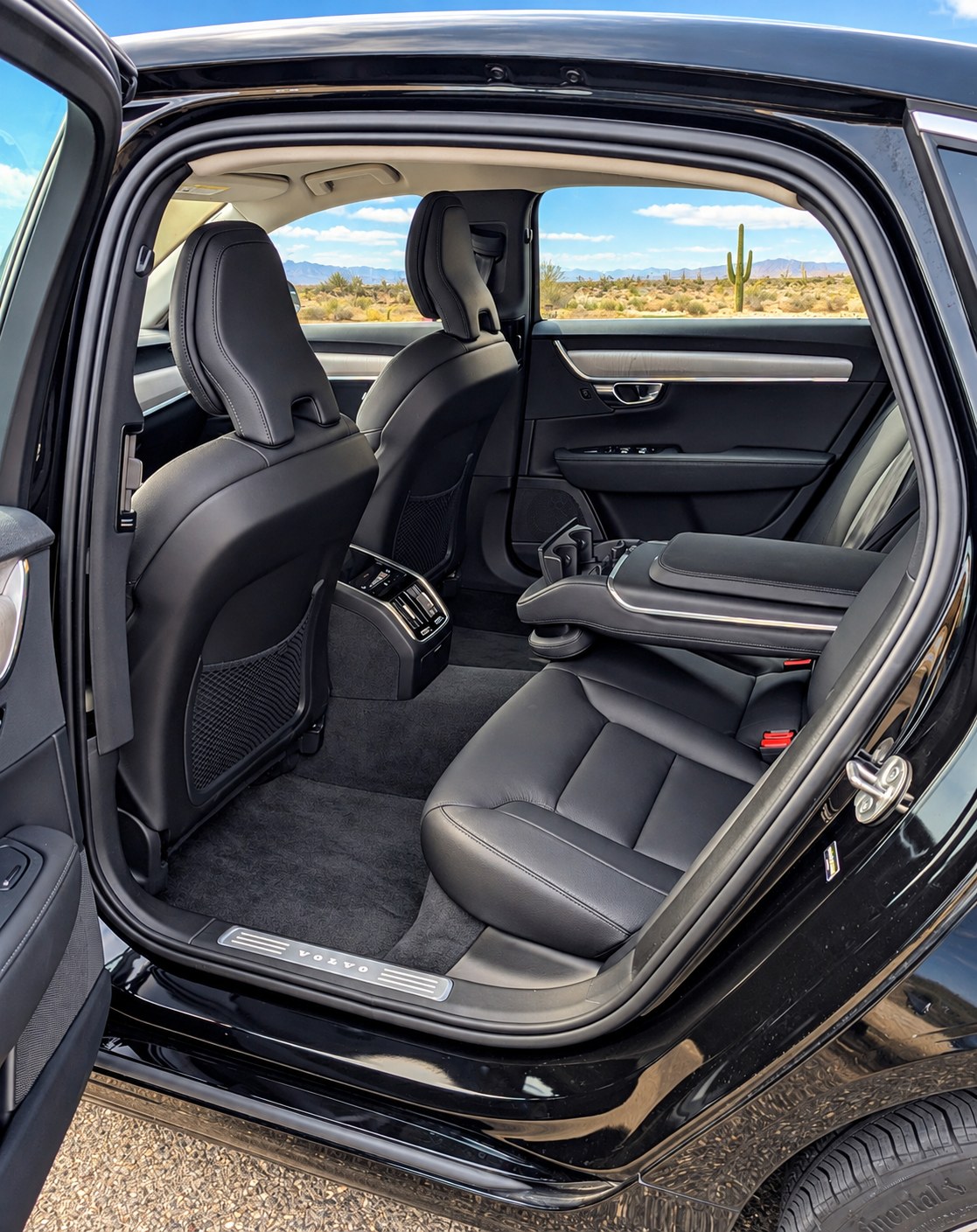 Black sedan interior with spacious rear passenger seating.