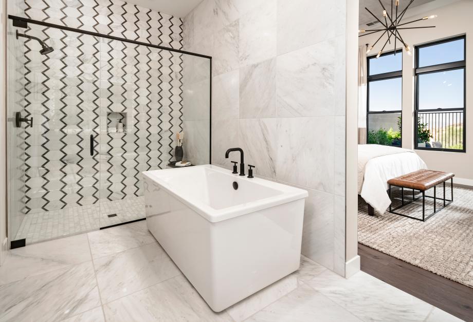 Luxe primary bathrooms with free-standing tubs, large walk-in showers, and dual-sink vanities