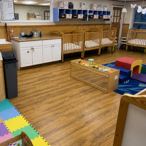Bright and colorful preschool classroom at Childcare Network with age-appropriate learning materials 