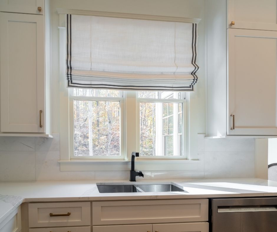 Roman Shades add style and complete this kitchen window. Budget Blinds of Chilliwack, Hope and Harrison Chilliwack (604)824-0375