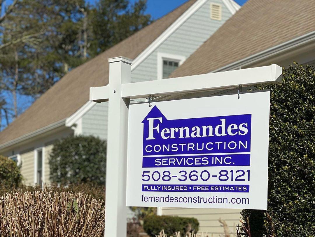Fernandes Construction Service Inc. sign in front of a home with phone number 508-360-8121 stating they are fully insured free estimates fernandesconstruction.com