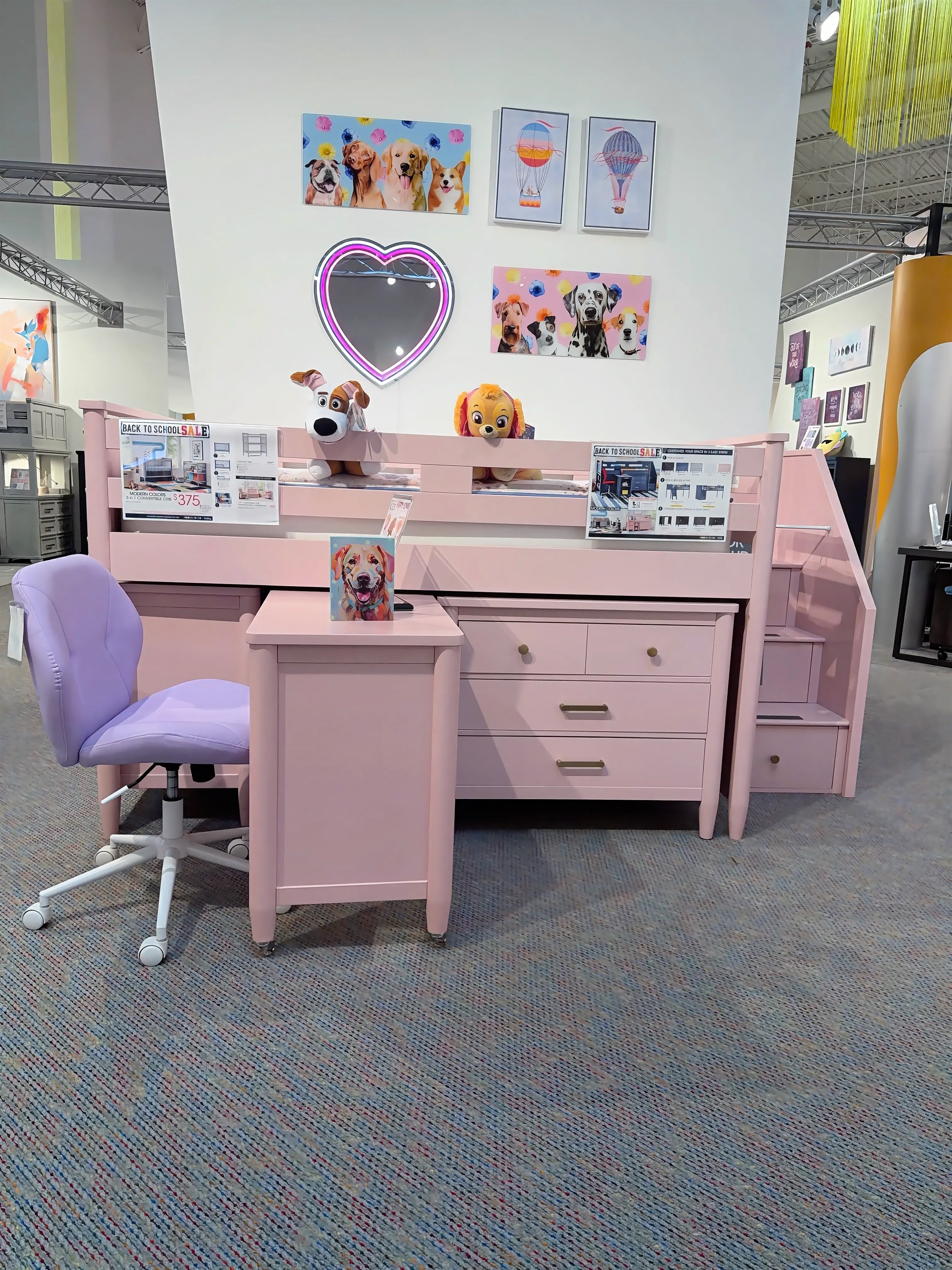 Explore the pink loft bed with desk, dresser, and storage stairs at Rooms To Go Kids